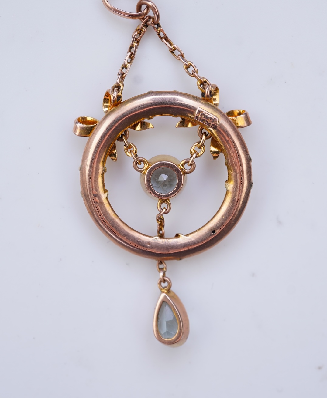 An Edwardian seed pearl and aquamarine pendant, circa 1910
